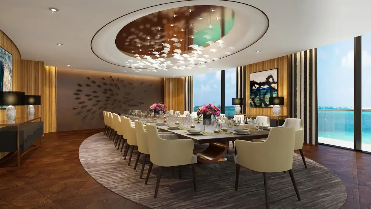 comedor de lujo ejecutivo diseñado para recibir a varias personas, con un amplio ventanal que ofrece impresionantes vistas al mar. Perfecto para reuniones exclusivas, cenas o momentos inolvidables en un entorno elegante.